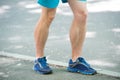 Prevent varicose concept. Legs of male athlete runner jogging park sidewalk. Training cardio in proper sport shoes Royalty Free Stock Photo