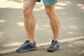 Prevent varicose concept. Legs of male athlete runner jogging park sidewalk. Training cardio in proper sport shoes Royalty Free Stock Photo