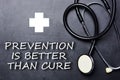 Prevention is better than cure text on chalkboard near medical object and symbols