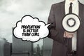 Prevention is better than cure text on speech bubble with businessman