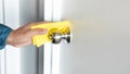 Prevention concepts on coronavirus  covid-19  outbreak situation with person cleaning doorknob by alcohol.body health care Royalty Free Stock Photo