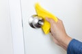 Prevention concepts on coronavirus  covid-19  outbreak situation with person cleaning doorknob by alcohol.body health care Royalty Free Stock Photo