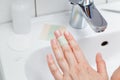 Narrow strip of adhesive plaster is glued on finger Royalty Free Stock Photo