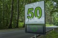 Prevention radar, speed limit detection device, digital alert sign - It shows green happy face and speed limit 50 on a street Royalty Free Stock Photo