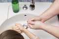 prevention of viruses. dad with son and daughter washing of hands soap foam and water. Disinfection against bacteria and Royalty Free Stock Photo