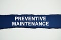 Preventive Maintenance text on navy blue with white paper torn ripped of horizontal Royalty Free Stock Photo