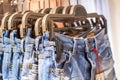 Preview jeans hanging on a hanger in the store