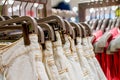 Preview jeans hanging on a hanger in the store