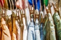 Preview jeans hanging on a hanger in the store