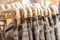 Preview jeans hanging on a hanger in the store