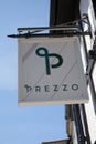 The Prezzo logo hanging from a restaurant in the UK