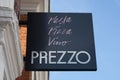 The Prezzo logo on a restaurant wall in Beaconsfield, Buckinghamshire, UK