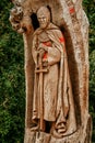 Templar knight monument carved in the wood of a tree trunk