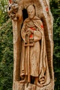 Templar knight monument carved in the wood of a tree trunk