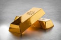 Price gold on stock exchanges. Two Gold bars or bullion on grey metal background. Financial, global world economic or gold trading