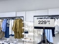 price label over blurred clothing shop interior