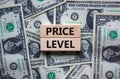 Price level symbol. Concept words `Price level` on wooden blocks on a beautiful background from dollar bills. Business and price