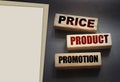 Price product promotion words on wooden blocks on black. Marketing sales concept