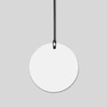 Blank round paper price tag with string. Royalty Free Stock Photo