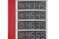 Prices on the information board of the petrol station. Numbers on the metal surface with mechanically movable covers. Cyrillic Royalty Free Stock Photo