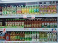 Prices of various vegetable oils paste on the shelves at the wholesale store.