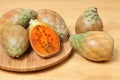 Prickly pear cactus fruits - Opuntia ficus indica; photo on wooden background Royalty Free Stock Photo