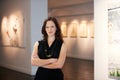 Pride, arms crossed and portrait of a woman at an art gallery for an exhibition. Creative, culture and a museum manager Royalty Free Stock Photo