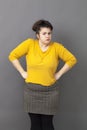 Pride and arrogance for offended big young woman standing up