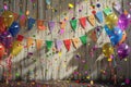 Pride celebration with rainbow flags, balloons, and empowering banners on a vibrant wooden background Royalty Free Stock Photo