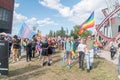 Pride LGBT march. Guys, girls, queers and gender diversity with rainbow flag at gay pride parade
