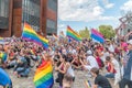 Pride LGBT march. Guys, girls, queers and gender diversity with rainbow flags at gay pride parade