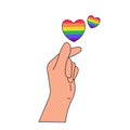 Pride LGBT symbols. Hand holds hearts in rainbow colors. Supporting love freedom.