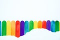 pride month background concept with ripped white mock up paper on colorful popsicle sticks,LGBTQ colors for background, rainbow