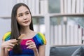 Pride Month. Woman combing her hair on the sofa. Woman brushing and detangling long hair of her Royalty Free Stock Photo