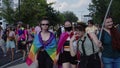 Pride parade Warsaw. Crowd of people in colorful clothing and with rainbow flags marcing for the lgbq right