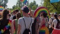 Pride parade Warsaw. Crowd of people in colorful clothing and with rainbow flags marcing for the lgbq right