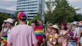 Pride parade Warsaw. Crowd of people in colorful clothing and with rainbow flags marcing for the lgbq right