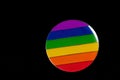 Pride Rainbow badge on black background