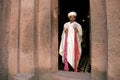 Priest at ancient rock hewn churches of lalibela ethiopia