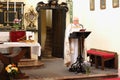 Priest baptizing little kid