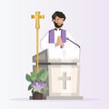 Priest behind church lectern with purple stole preaching during the mass