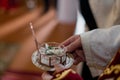 Priest bestowing blessing on wedding rings. Symbolic exchange, matrimonial vow ritual. Christian marriage, ecclesiastical ceremony Royalty Free Stock Photo