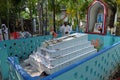 The priest blesses religious objects at the tomb of a Croatian missionary, Jesuit father Ante Gabric in Kumrokhali, India