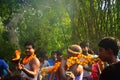 A priest bringing the holy water for the worship of Lord Shiva. the villagers enjoys the programme