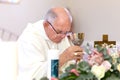 A Priest in a Catholic Church busy with prayer and mass/communion