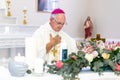 A Priest in a Catholic Church busy with prayer and mass/communion