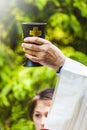 Priest is celebrating christian religious rite