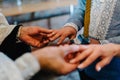 The priest changes the wedding rings on the fingers of the bride and groom. Wedding tradition and ritual. hands of young couples Royalty Free Stock Photo