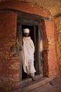 Priest on the doorway of Abuna Yemata Guh church