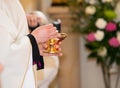 Priest granting the Communion Royalty Free Stock Photo